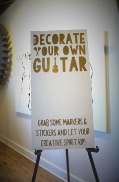 a sign that reads decorate your own guitar