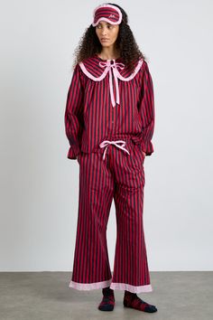 Red and navy stripes adorn our Maria pyjama set, trimmed with baby pink and cropped at the leg. If you're feeling extra, match these with our corresponding eye mask. • Top and bottoms • Matching bag included • Oversized collar • Button fastening at back • Cropped leg • Elasticated waist with functional tie • 100% organic cotton • Designed in London MODEL INFO: Model is 5'10 and is wearing a UK 8. Crochet Stripe Scarf, London Models, Oversized Collar, Checked Scarf, Striped Pyjamas, Hooded Scarf, Striped Scarves, Pink Gingham, Striped Cardigan