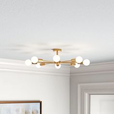 an image of a bathroom setting with lights on the ceiling and mirror in the corner