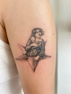 a woman with a tattoo on her arm is sitting in the middle of a triangle