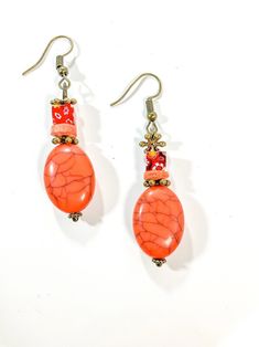 Orange distressed style dangle earring with bronze ear wire for earlobe. All my items are handmade one at a time and no two items will be the same and I work hard to provide a top-quality product.  Please be assured each item is made with care, fun, and love to share with those who enjoy the beauty of handmade items, and every sale is appreciated and supports small business. Handmade Coasters, Resin Flowers, Beaded Dangles, Flower Shape, Dried Flowers, Beaded Earrings, Jewelry Earrings Dangle, Etsy Earrings, Dangle Drop Earrings