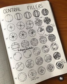 an open notebook with various circular fillers on the pages and numbers in each section