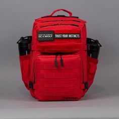 a red backpack with the words trust your instructs written on it, sitting against a gray background