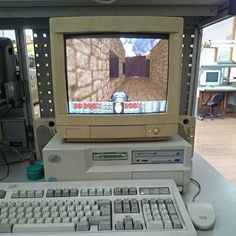 an old computer sitting on top of a table