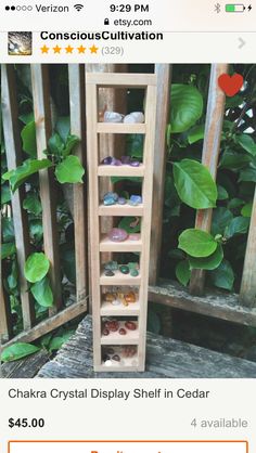 a wooden shelf filled with lots of different colored rocks