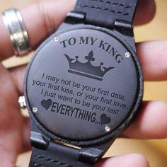 a person holding a watch with the words to my king on it's face