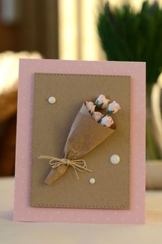 a small card with a bouquet of flowers on it