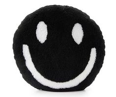 a black and white smiley face plush toy