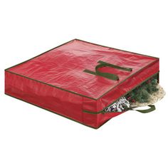 a large red bag filled with christmas decorations