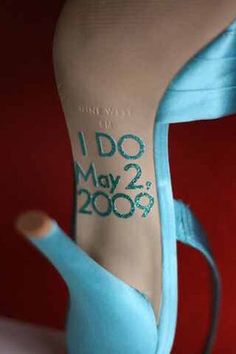 a blue shoe with the words i do may 2009 written on it's heel