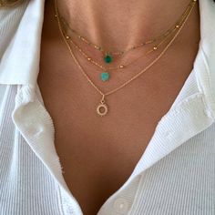 Stainless steel women's necklace with a fine ball chain and a small square-shaped stone that is a frosted blue amazonite. Minimalist and chic, it is perfect to give as a gift! This necklace goes very well with other gold necklaces. Details: Chain material: stainless steel Stone: amazonite (or your choice of black onyx). Height of the Stone:6mm Length of the chain: 40 cm +5 cm of adjustment chain. Gold Minimalist Charm Necklaces With Natural Stones, Minimalist Gold Beaded Necklace With Natural Stones, Gold Minimalist Beaded Necklace With Natural Stones, Minimalist Gold Charm Necklaces With Natural Stones, Minimalist Gold Charm Necklace With Natural Stones, Minimalist Amazonite Jewelry Gift, Minimalist Everyday Amazonite Jewelry, Everyday Minimalist Amazonite Jewelry, Handmade Gold Amazonite Necklaces