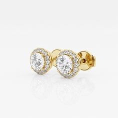 Enhance your everyday studs with these halo diamond stud earings. Each large round lab grown diamond is encircled with enchanting smaller diamonds to create a halo effect. Luxury Gold Halo Design Cluster Earrings, Luxury Gold Halo Design Earrings, Classic Round Diamond Earrings With Halo, Classic Round Halo Diamond Earrings, Halo Lab Grown Diamond Earrings Round Cut, Classic Round Cut Diamond Earrings With Halo Setting, 14k Gold Halo Diamond Earrings, Lab Grown Diamond Earrings With Halo Design, Lab-grown Diamond Earrings With Halo Design