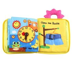 an open book with a clock on the cover and other items in it, including a toy