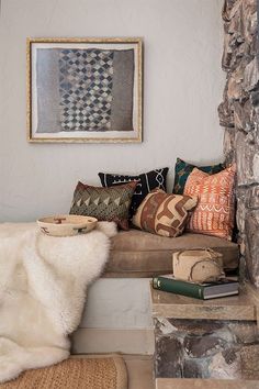 a living room filled with furniture and pillows