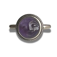 Genuine 10MM carved amethyst cabochon moon face sterling silver adjustable ring. Natural 10MM amethyst cabochon hand carved with smiling face Bezel set in sterling ring shank  Antiqued rope border Adjustable ring measures size 7 but adjustable to 9 comfortably Perfect for men and women This listing is for 1 ring  Thanks for stopping by Adjustable Amethyst Ring With Natural Stones, Spiritual Hallmarked Amethyst Ring, Rope Border, Ring Shank, Moon Face, Smiling Face, Smile Face, Adjustable Ring, Bezel Setting