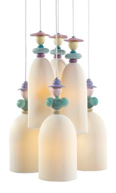 five white lamps with different colored lights hanging from them