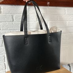 Nwt Tote Bag With Dual Carry Handles, Topstitching + Seaming Details And Embossed Ck Monogram Logo On The Front. 13.4" Wide X 15.4" Tall X 4.7" Deep Calvin Klein Rectangular Shoulder Bag For Daily Use, Calvin Klein Rectangular Bag With Removable Pouch, Calvin Klein Rectangular Bags For Daily Use, Calvin Klein Travel Bag With Removable Pouch, Modern Calvin Klein Black Bag, Modern Black Calvin Klein Bag, Calvin Klein Tote Bag With Removable Pouch, Calvin Klein Black Rectangular Bag, Black Rectangular Calvin Klein Bag