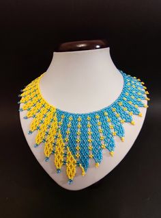 Beautiful bright yellow and blue necklace.Made of Czech beads Length 17.4 inches (44 cm) The width at the bottom of the necklace is 3 inches (7.5 cm) Chain to adjust the length of 2 '' (5 cm) Handmade Yellow Beaded Necklaces For Gifts, Handmade Yellow Beaded Necklaces As Gift, Yellow Necklaces With Large Beads For Crafting, Yellow Beaded Necklaces For Jewelry Making, Unique Yellow Beads For Jewelry Making, Yellow Beaded Bib Necklaces As Gift, Yellow Beaded Bib Necklace As A Gift, Unique Yellow Beaded Necklaces For Festival, Yellow Beaded Necklace As Gift