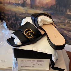 Authentic Gucci Marmont Gg Leather Sandal Brand New Size 36(6) Black Leather Upper Smooth Leather Sole Gold Tone Hardware With Classic Double G Made In Italy Includes Everything Shown Smoke Free Environment Gucci Luxury Sandals With Buckle Closure, Luxury Gucci Sandals With Buckle Closure, Chic Calf Leather Slides With Round Toe, Calf Leather Open Toe Slides, Designer Round Toe Mules With Buckle Closure, Designer Black Slides With Buckle Closure, Designer Mules With Buckle Closure And Round Toe, Designer Black Mules With Buckle Closure, Gucci Open Heel Sandals With Buckle Closure