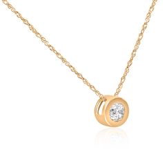 This classic women's solitaire pendant features one round brilliant cut natural diamond.  The diamond is bezel set in solid 14k yellow gold.  An 18" 14k yellow gold chain is included. Diamond Flower Pendant, Solitaire Diamond Pendant, Round Solitaire, Solitaire Pendant Necklace, Diamond Pendants, Gold Jewelry Simple, Bezel Pendant, Heart Pendant Diamond, Jewelry Simple