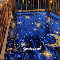 a wooden deck with stars and moon on it