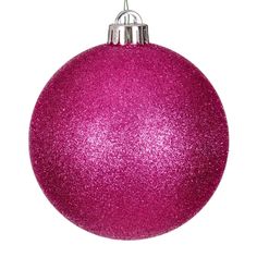 a pink ornament hanging on a white background