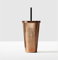 a starbucks cup with a straw in it