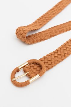 Stay on-trend with this stylish braided belt. The accents of suede and a sleek oval buckle give it a unique, contemporary look that will be sure to turn heads. Perfect for both casual and dressier occasions. #completeyourlook #lovemyleto 100% PVC Imported Luxury Adjustable Braided Belts, Braided Belts, Luxury Braided Brown Belt, Brown Woven Leather Belt, Braided Leather Belt, Casual Bodysuit, Bachelorette Dress, Sorority Rush Dresses, Rush Dresses