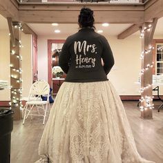 a woman wearing a skirt with the words mrs henry printed on it