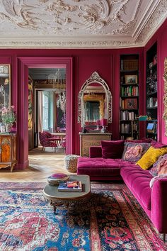 a living room filled with lots of purple furniture