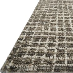 an area rug is shown with white and brown squares