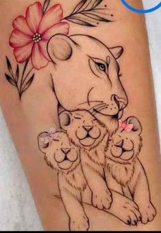 a woman's leg with a tattoo on it that has an image of a lion and two cubs