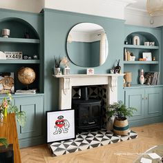 a living room filled with furniture and a fire place in front of a wall mounted mirror