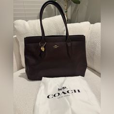 Excellent Condition. Large Handbag In Deep Burgundy Leather. Features Gold Hardware. Interior Has One Large Zip Pocket And Two Slide Pockets. Front Also Has One Large Exterior Pocket. Both Sides Have Optional Snaps To Expand Depth. Also Has Feet On The Bottom. 9 1/2”L X 15”W X 4 1/2”D Large Handbag, Bags Coach, Deep Burgundy, Large Handbags, Coach Leather, Leather Handbag, Coach Bags, Gold Hardware, Zip Pockets