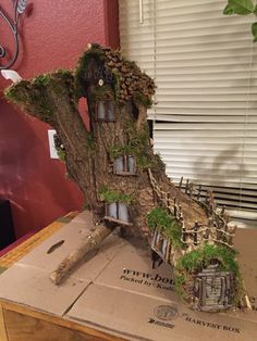 the tree house is made out of cardboard