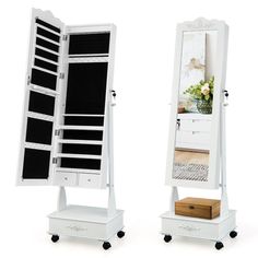 two white mirrors with drawers on each side and a shelf in the middle for storage