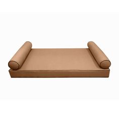 a brown dog bed with rolled up pillows