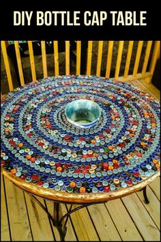 a table made out of bottle caps sitting on top of a wooden floor next to a chair