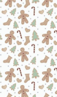 gingerbread cookies and candy canes are arranged on a white background