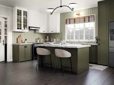 a kitchen with green cabinets and white counter tops