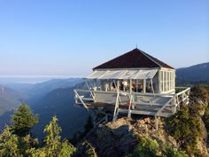 a white gazebo sitting on top of a mountain