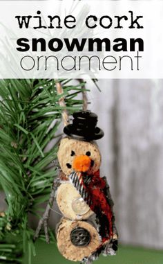 a wine cork snowman ornament hanging from a christmas tree with pine branches