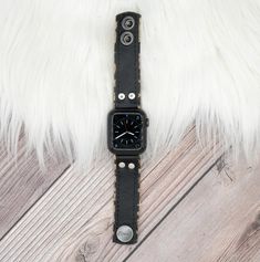 Perfect for those who love a simple natural look. Our natural leather is of the highest quality and softest material. Every piece cut from the leather is unique, with its own imperfections and natural marks. Each band is just as distinctive as our skin, unlike anyone else�’s, and with its own story to tell. Apple Watch Skinny Band Black leather stitched to Leopard Leather Embellishments and Adapters will be matched to Apple Watch Color Approximately 1" wide Adjustable snap closure