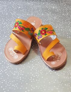 Mexican Sandals are made with soft insole and durable outsole. Rubber sole for comfortable walking! Strips are made with leather and decor with mexican embroidered. Huaraches are perfect as Summer shoes. They are unique and original.Easy to wear with jeans, dresses and shorts.*Need special size? - Please send a message, gladly assit you! We have more designs*In wholesale special prices!(Remember that because are made of leather it is required to use them to fit them)Shipping:Ready to ship within Orange Single Toe Strap Sandals For Spring, Bohemian Yellow Sandals For Spring, Yellow Bohemian Sandals With Round Toe, Yellow Bohemian Round Toe Sandals, Yellow Bohemian Leather Sandals, Bohemian Yellow Leather Sandals, Traditional Open Toe Sandals For Spring, Yellow Leather Bohemian Sandals, Handmade Yellow Sandals For Summer