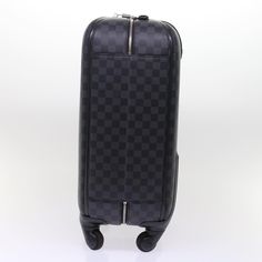 Brand: Louis Vuitton Model: Zéphyr Color: Black Material: Canvas Inclusions: Dust Bag Dimensions: W36cm x H55cm x D24cm Serial number: BA0184 Country of origin: France Condition: AB - good condition. The Louis Vuitton Zéphir Suitcase in Damier Graphite is a sleek and sophisticated travel essential, skillfully crafted from the brand's signature Damier Graphite canvas. The color palette features a contemporary black and gray checkered pattern, exuding modernity and versatility for diverse travel n Designer Black Rectangular Travel Bag, Designer Black Bag With Rectangular Case, Designer Black Travel Bag, Designer Black Bags With Rectangular Case, Designer Black Rectangular Case Bag, Designer Black Luggage With Sleeve, Designer Black Rectangular Case Shoulder Bag, Luxury Black Shoulder Bag For Business Trips, Designer Black Rectangular Shoulder Bag