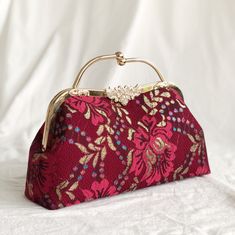 This Red Peony purse is made from a luxurious dark red Peony flower patterned lace, has both a hand clasps and long chain for convenient daily use and is great as a daily bag, or for a special occasion. **Along with the order, we will give you a free wallet made of the same fabric ：） --------------------------------- Details: Color: Dark red Peony flower pattern Fabric: Composite lace Capacity: Day to day items (phone, wallet, keys, lipstick, makeup bag etc) Function: hand held, shoulder or cros Cheap Red Embroidered Bags, Luxury Red Pouch Satchel, Cheap Embroidered Red Bags, Affordable Elegant Red Coin Purse, Luxury Traditional Red Shoulder Bag, Luxury Handmade Red Bags, Red Peony, Pattern Purse, Unique Handbags