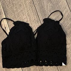 This Beautiful Black Bralette Can Be Worn Under Many Different Tops! Beautiful Scalloped Lace, Adjustable Spaghetti Straps, Pull Over Closure, Elastic Band At Back, Padded/ Can Remove Pads If Needed, *Final Sale Item*, No Returns Or Exchanges, Materials: 90% Nylon, 10% Spandex, Lining: 95% Polyester, 5% Spandex, This Is For 1 Black Bra, The Champagne Bra Is Sold Separately. Measurements: Medium Bust: 26”( Without Stretching Out) Cherish Brand Sizes: Small, Medium, Large Black Spaghetti Strap Crop Top For Beach, Black Cami Halter Top For The Beach, Black Seamless Halter Top For Spring, Casual Black Summer Bra, Spring Black Halter Top Bra Friendly, Spring Black Bra-friendly Halter Top, Black Halter Top With Spaghetti Straps For Spring, Black Spaghetti Strap Halter Top For Spring, Vacation Black Crop Top Bra-friendly