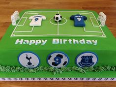 a green birthday cake with soccer themed decorations