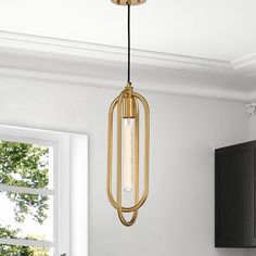 a light fixture hanging from the ceiling in a kitchen