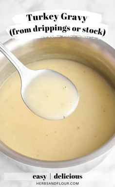 turkey gravy from drippings or stock in a pot with a ladle